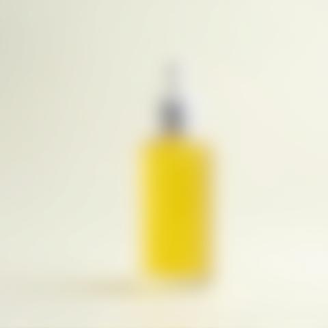 Photo of an organic facial serum bottle with a pipette